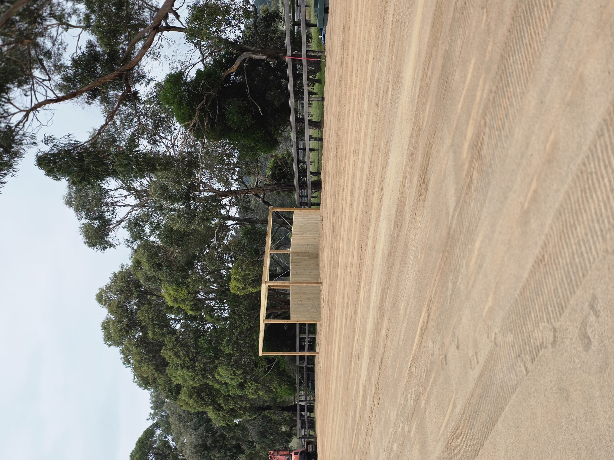 Original camera photograph of the arena-side timber shelter